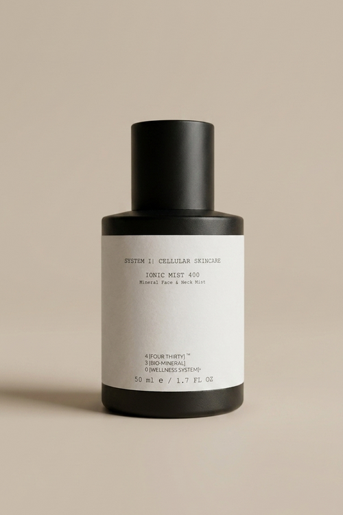Skincare bottle with black cap and white label on a beige background